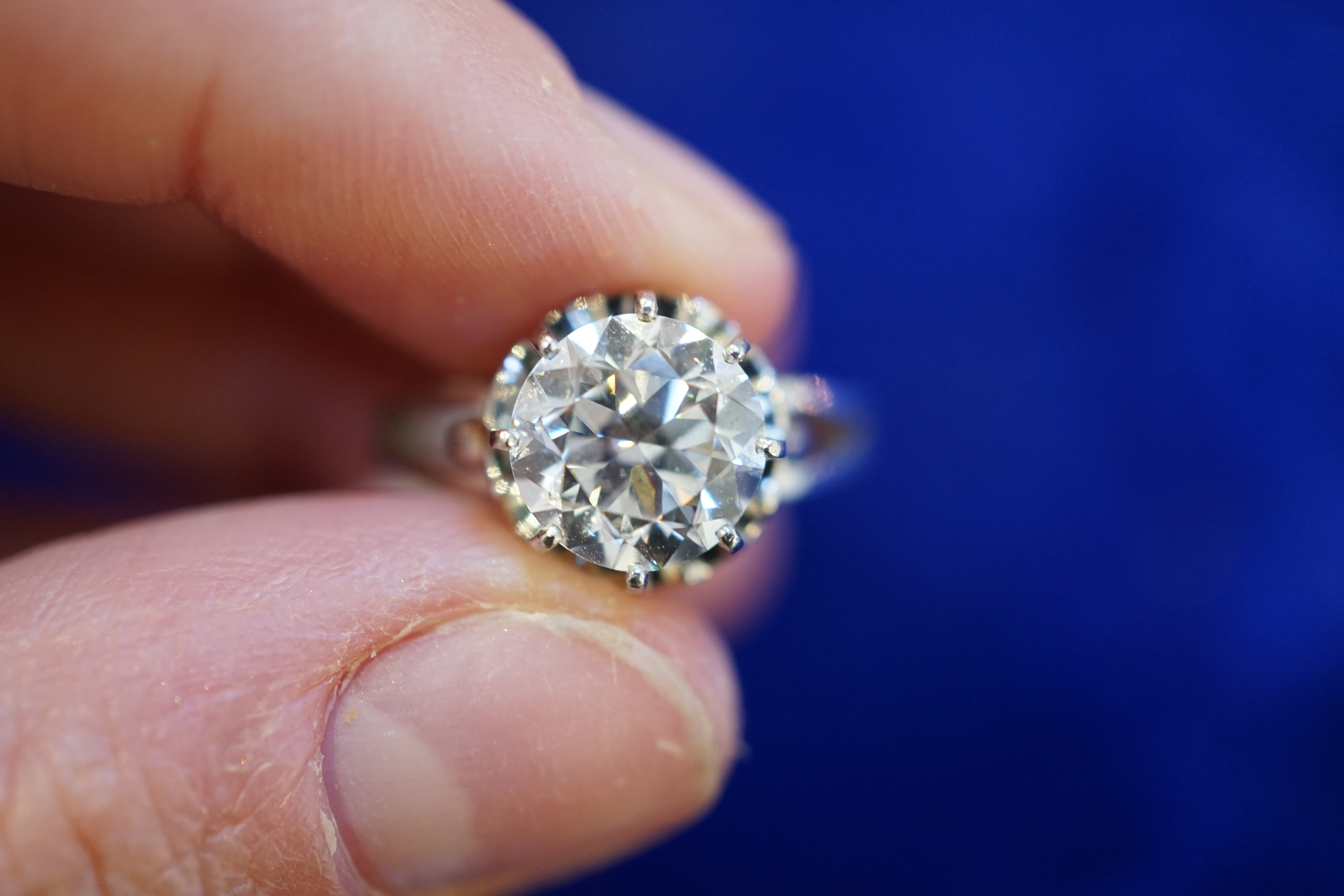 A platinum and solitaire diamond set ring